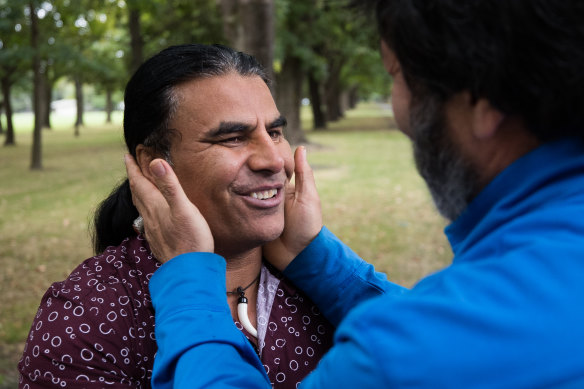 'You saved us': Abdul Aziz is embraced by a fellow Muslim two days after the massacre.
