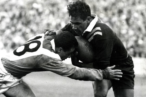 Lionel Morgan gives a French defender short shrift in 1960.