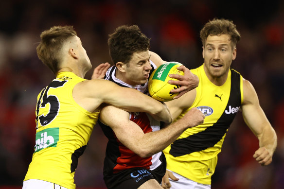 St Kilda’s Jack Higgins is tackled by Richmond’s Jayden Short.