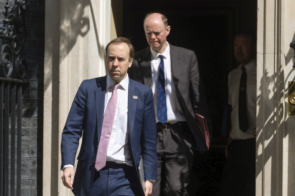 Britain's Health Secretary Matt Hancock (left) and Chief Medical Officer Chris Whitty outside 10 Downing Street on May 4.