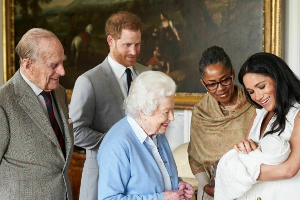 Prince Harry and Meghan, joined by her mother Doria Ragland, introduce Archie to the Queen and Prince Philip in 2019.