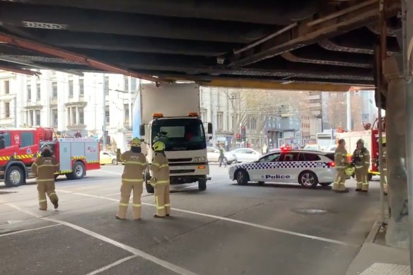 Sections of Melbourne’s rail network have been thrown into chaos after a truck was wedged under a rail bridge on Tuesday.