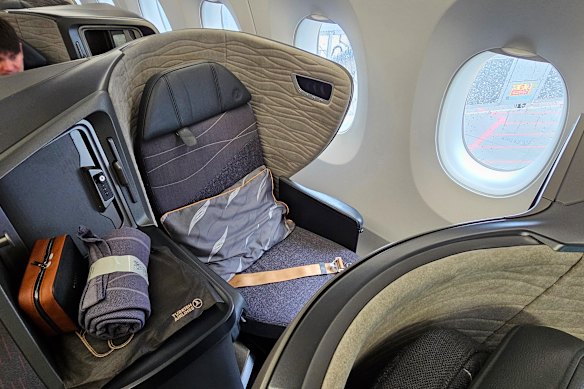 The seat has direct aisle access, but feels tight.