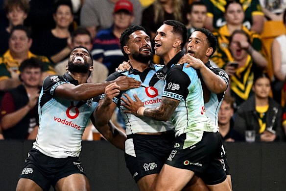 Taane Milne scores against the Kangaroos in the World Cup.