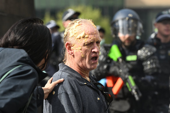 A protester at the Land Forces rally covered in pepper spray.