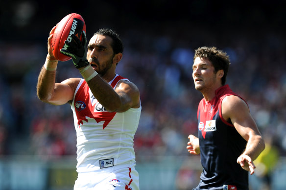 Adam Goodes marks in front of Colin Garland.