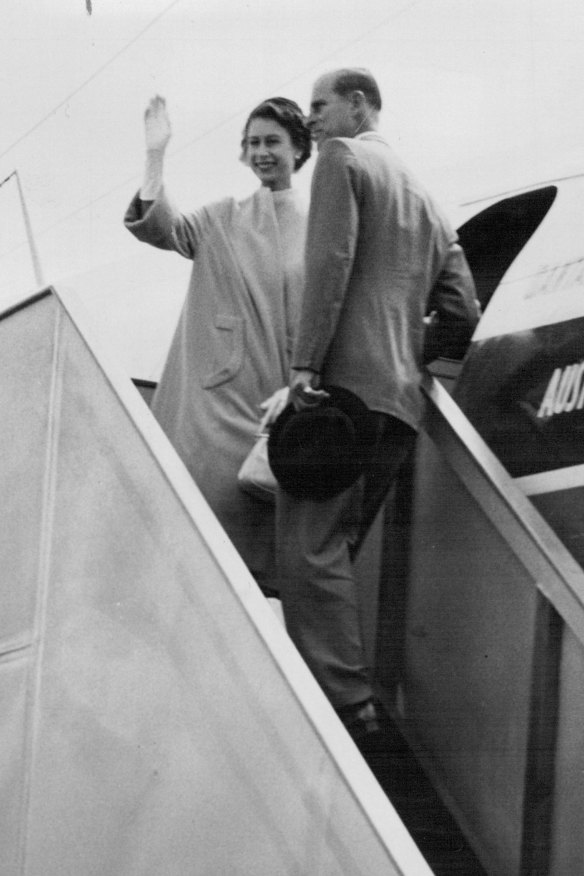 Queen Elizabeth and Prince Phillip wave to crowds at Essendon Airport in 1954.