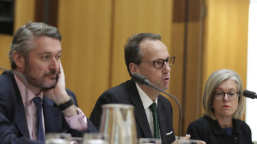 Daniel Crennan, James Shipton and Karen Chester from the Australian Securities and Investments Commission (ASIC) during a hearing with the Standing Committee on Economics at Parliament House in Canberra
