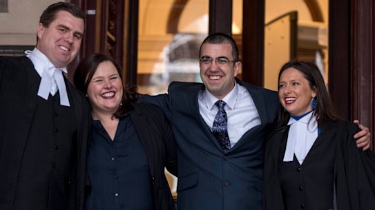 Faruk Orman (in glasses) on the steps of the Supreme Court with his lawyers on Friday. 