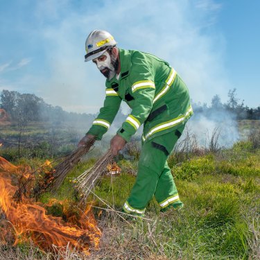 Mick Bourke lights a fire using traditional methods in Boort, Victoria in September 2019.