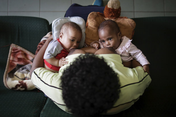 Susu Mamas midwife Sylvia Nikints breastfeeds her five-month-old babies Zita and Zion.