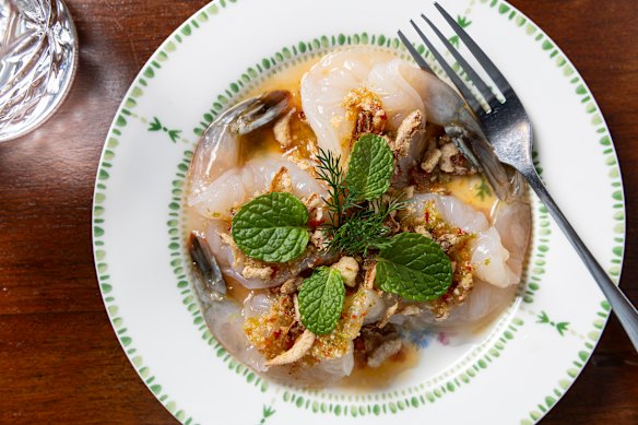 Goong chae nam pla prawns (raw prawns marinated in fish sauce, lime and sugar, then dressed with coriander root, chilli, garlic and lime).