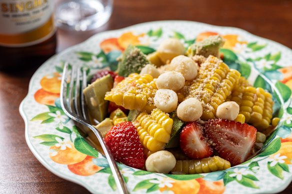 Som tum kao poht with corn, avocado, strawberry and macadamia.