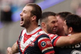 Sam Walker and the Roosters celebrate a try.