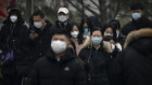 Commuters in the central business district of Beijing. China has reported fewer than 40 deaths since the major pivot away from COVID-Zero in early December.