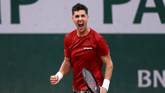 Thanasi Kokkinakis celebrates at Roland-Garros.
