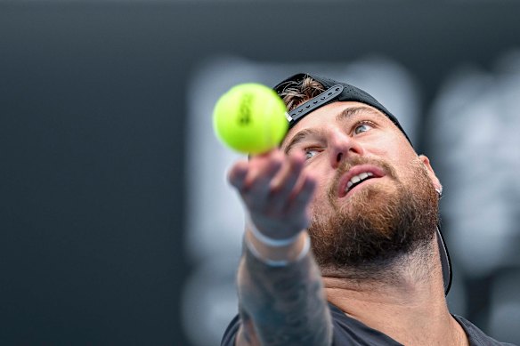 Omar Jasika serves in his first-round match.