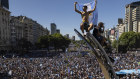 Argentine soccer fans celebrate their team’s World Cup victory over France, in Buenos Aires.