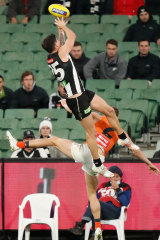 Jack Crisp flies high for the Magpies.