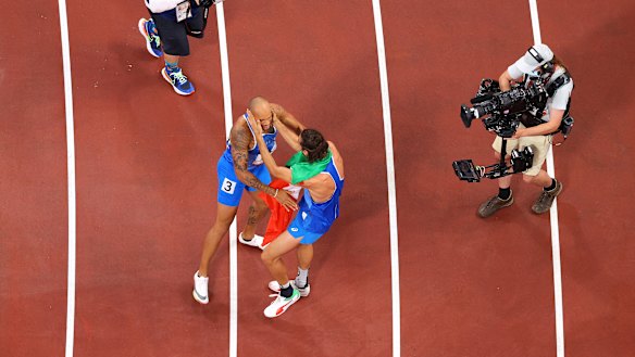 Jacobs and Tamberi embrace.