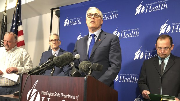 Washington Governor Jay Inslee, centre, speaking after a man in Washington state is identified as the first known person in the United States to catch a new type of coronavirus that officials believe originated in China. 