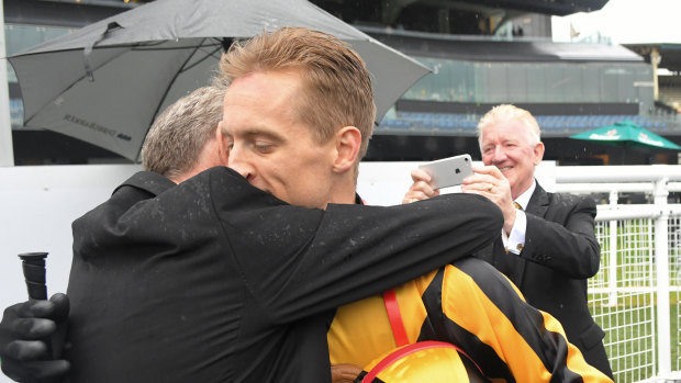 Brothers in arms: Trainer Gerald Ryan embraces Blake Shinn after Trapeze Artist's win.