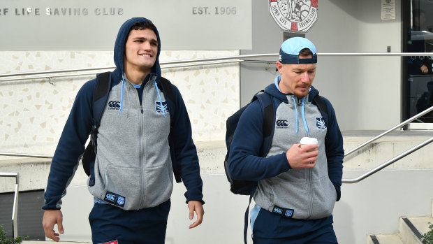 Duty calls: Cleary and Damian Cook head to a media session on Tuesday.