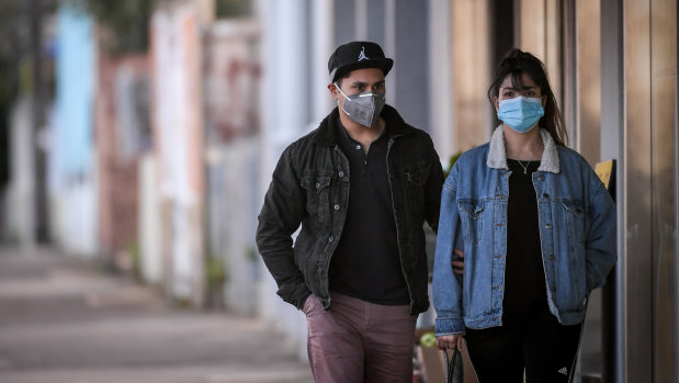 People on Lygon Street in Carlton on Wednesday, one week in Melbourne's lockdown 2.0.