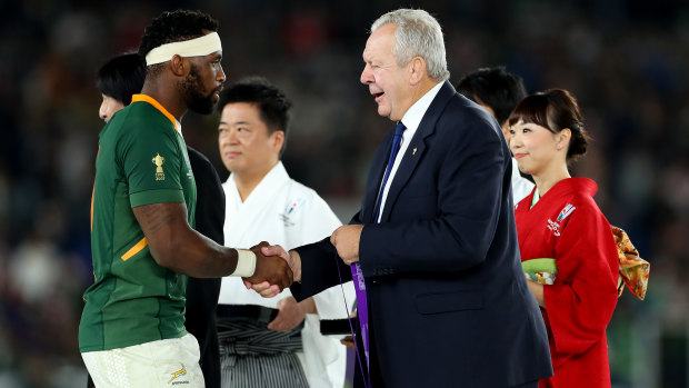 Bill Beaumont, right, has won a second term as World Rugby chairman. 