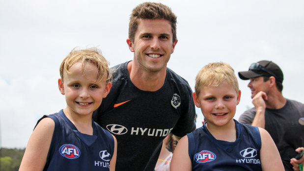Marc Murphy with young fans at the Blues' training camp in Mooloolaba this week.