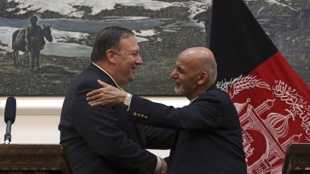 US Secretary of State Mike Pompeo, left and Afghan President Ashraf Ghani, shake hands after a press conference at the presidential palace in Kabul on July 9.