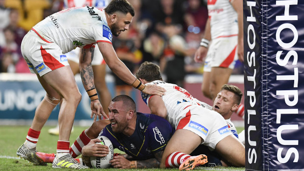 Nelson Asofa-Solomona goes over near the posts for the Storm at Suncorp Stadium.