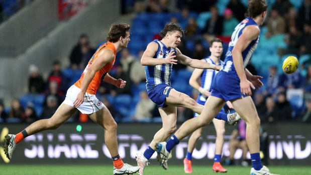 Cameron Zurhaar kicks a major for the Kangaroos at Blundstone Arena.