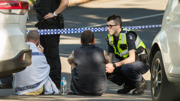 Two men who lived in the same unit block as the two woman attacked overnight return to the scene.