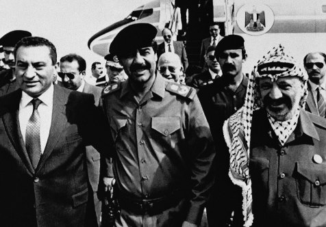 President Saddam Hussein, centre, greets President Hosni Mubarak, left, and Palestinian Liberation Organisation Chairman Yasser Arafat for talks aimed at a coordinated Arab position on Middle East peace, 1988.