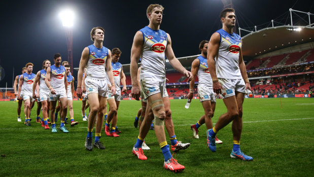 The Suns leave the field after being thrashed by the Giants.