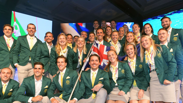 Hockey captain Mark Knowles (centre) poses for a photograph with members of the Australian Commonwealth Games team.