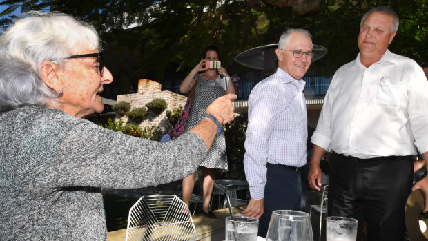 Prime Minister Malcolm Turnbull and LNP candidate for Longman, Trevor Ruthenberg,  cops some advice from local Toni Lea while out campaigning on Friday. 