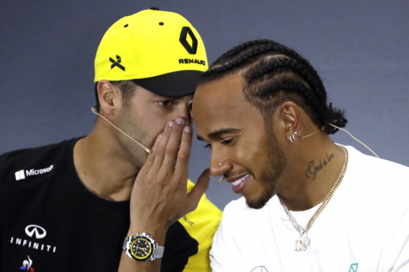 Speak up: Renault driver Daniel Ricciardo, left, with Lewis Hamilton, right, of Mercedes. 