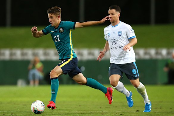 Sydney FC defender Joel King - who played for the Olyroos on Thursday night - skips ahead of teammate Alexander Baumjohann.