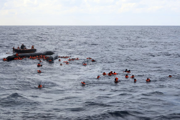 Rescuers come to the aid of migrants after one of the shipwrecks this week.