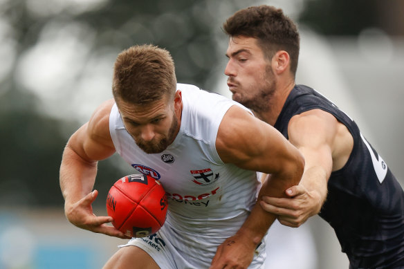 George Hewett lays a tackle on Dan Butler.