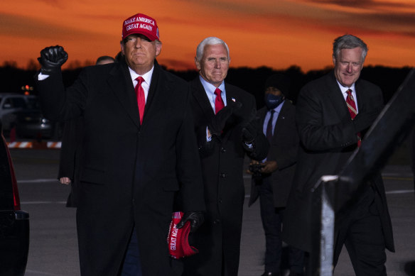 Donald Trump’s chief of staff Mark Meadows, on the right, pictured with Trump and vice-president Mike Pence on November 2, 2020. 