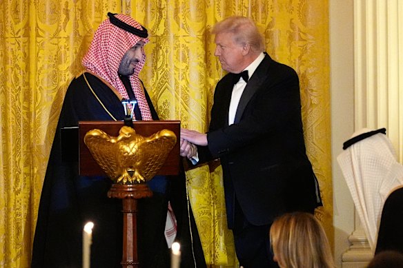 President Donald Trump shakes hands with Saudi Arabia’s Crown Prince Mohammed bin Salman at the formal dinner.
