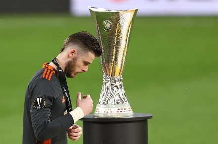 A heartbroken David De Gea removes his medal after the Europa League final.