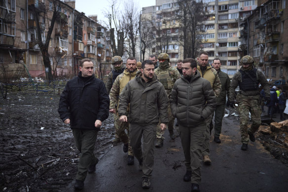 Ukrainian President Volodymyr Zelensky inspects damaged buildings as he visits town of Vyshgorod outside the capital Kyiv.