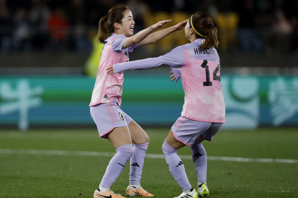 Japan celebrate a goal.