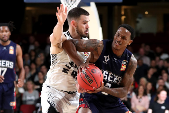 Melbourne's Chris Goulding (left) takes on the Sixers' Deshon Taylor in a recent pre-season match.