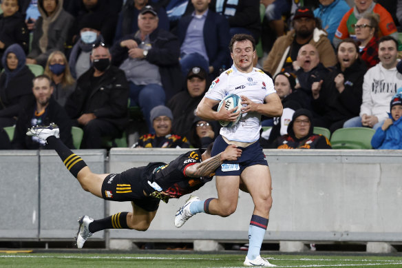 The Chiefs’ Rivez Reihana lays a try-saving tackle on Waratah Dylan Pietsch.