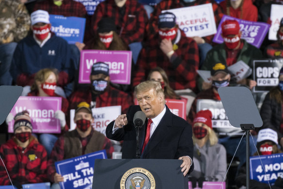 US President Donald Trump speaks during a Make America Great Again rally in Duluth, Minnesota.  